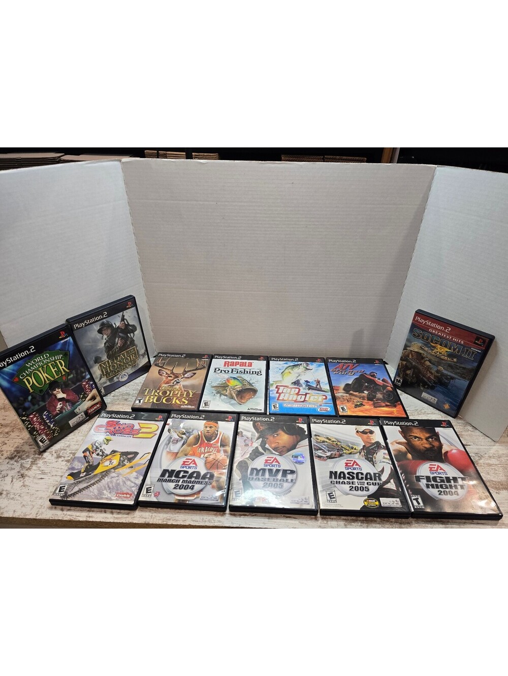 12- PS2 Games SOCOM II NASCAR 2005 NCAA March Madness 2004 Fight Night 2004 MORE